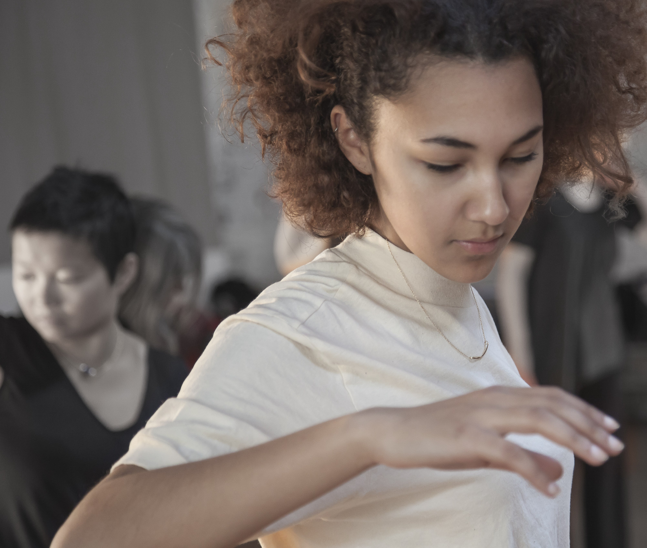 Woman turning her head to look at her hand