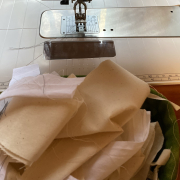 Muslin scraps in front of a sewing machine.