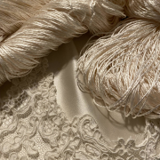 Silk yarn, fabric and lace.