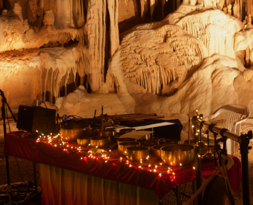 Brass bowls and candles in a cave