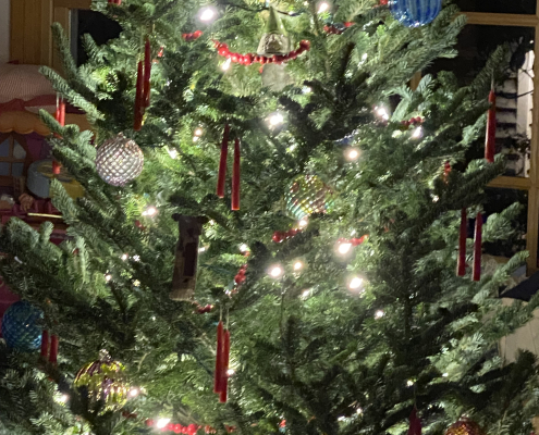 Christmas tree with lights, red candles and handblown glass balls
