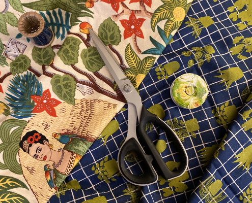 Quilting fabrics, pins, measuring tape and scissors