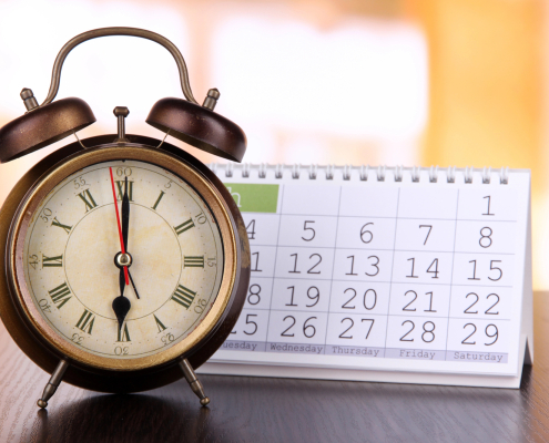 Alarm clock and calendar page