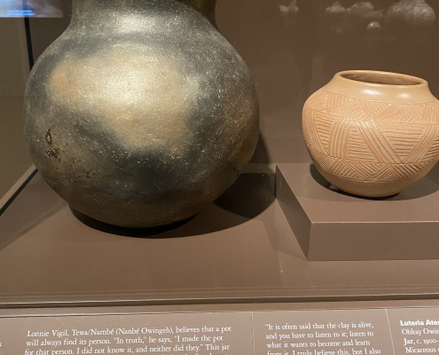 Two pieces of Pueblo pottery from a museum exhibit