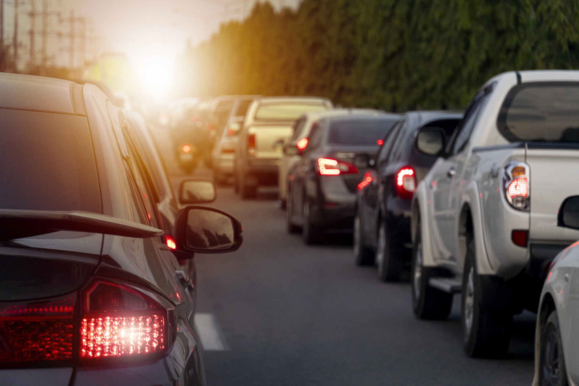 Traffic slowly moving toward sunset